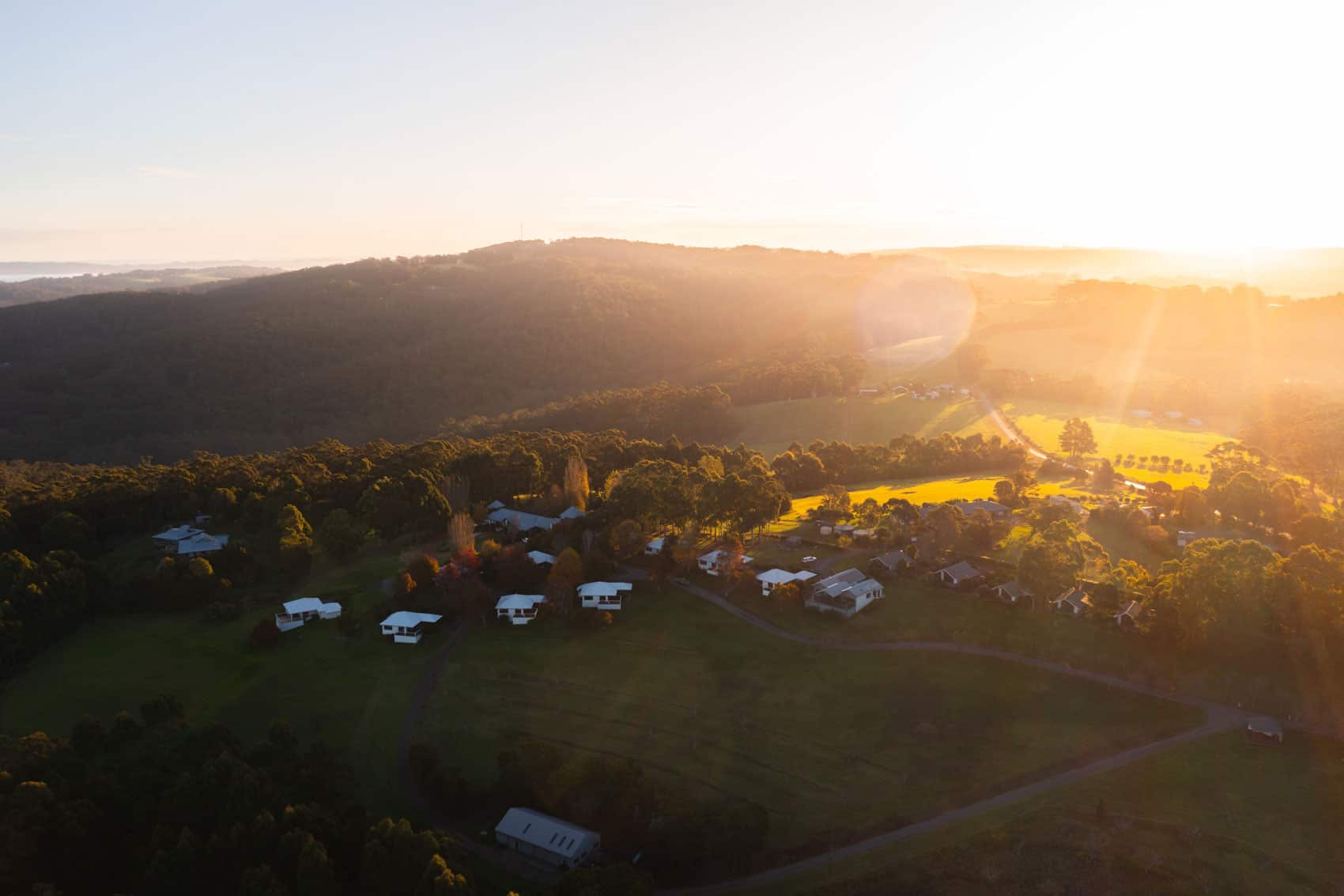 aerial view of karri mia chalets and studios in denmark at sunset
